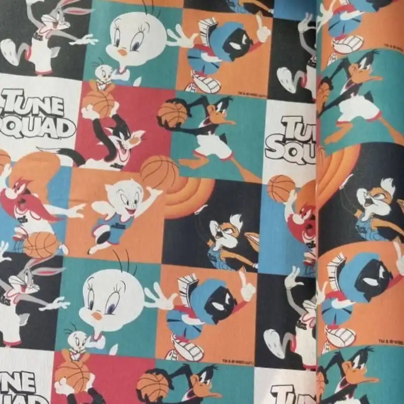 Novedad Tela de Mantelería Resinada Antimanchas Tune Squad Multicolor (ancho 1,40M)